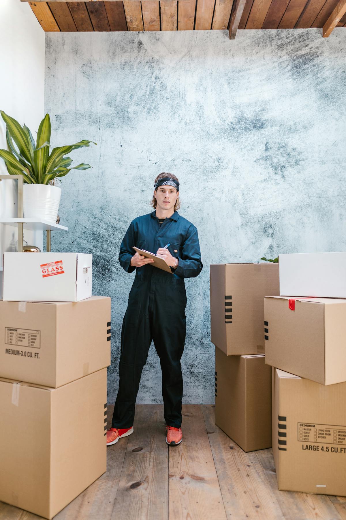 Team member organizing packed boxes