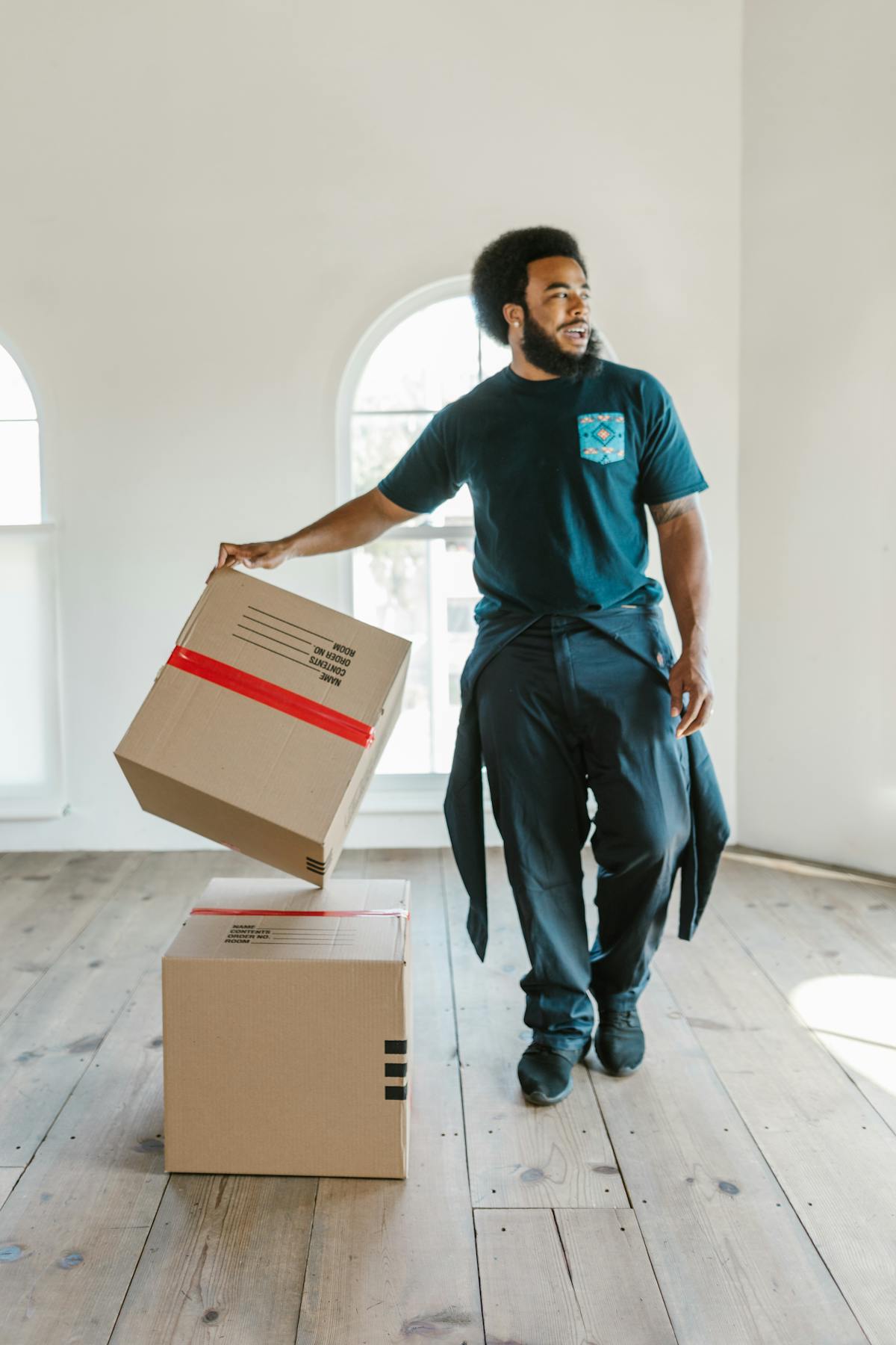 Crew member handling boxes carefully